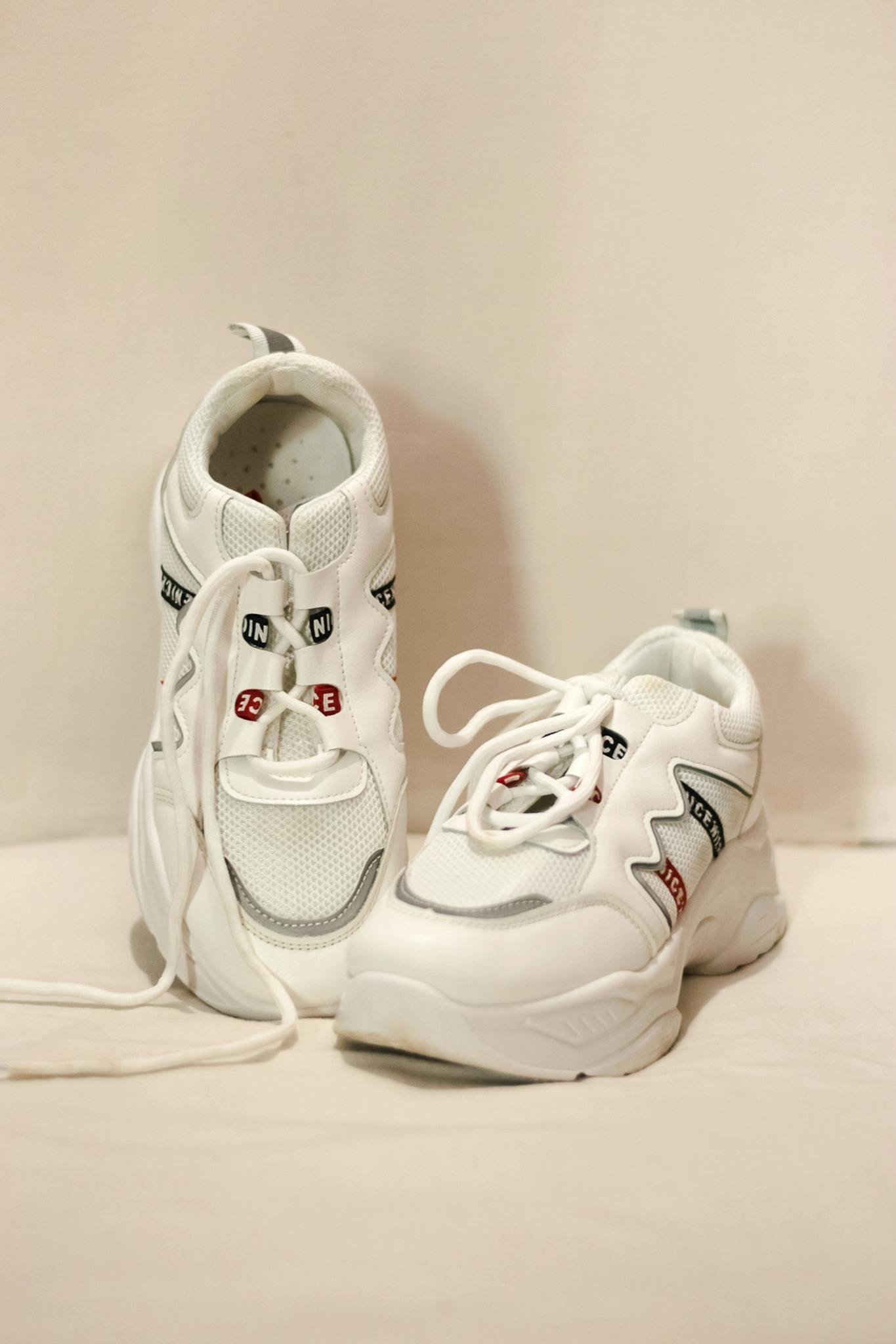 Close-up of trendy white sneakers with unique design details for fashion enthusiasts.